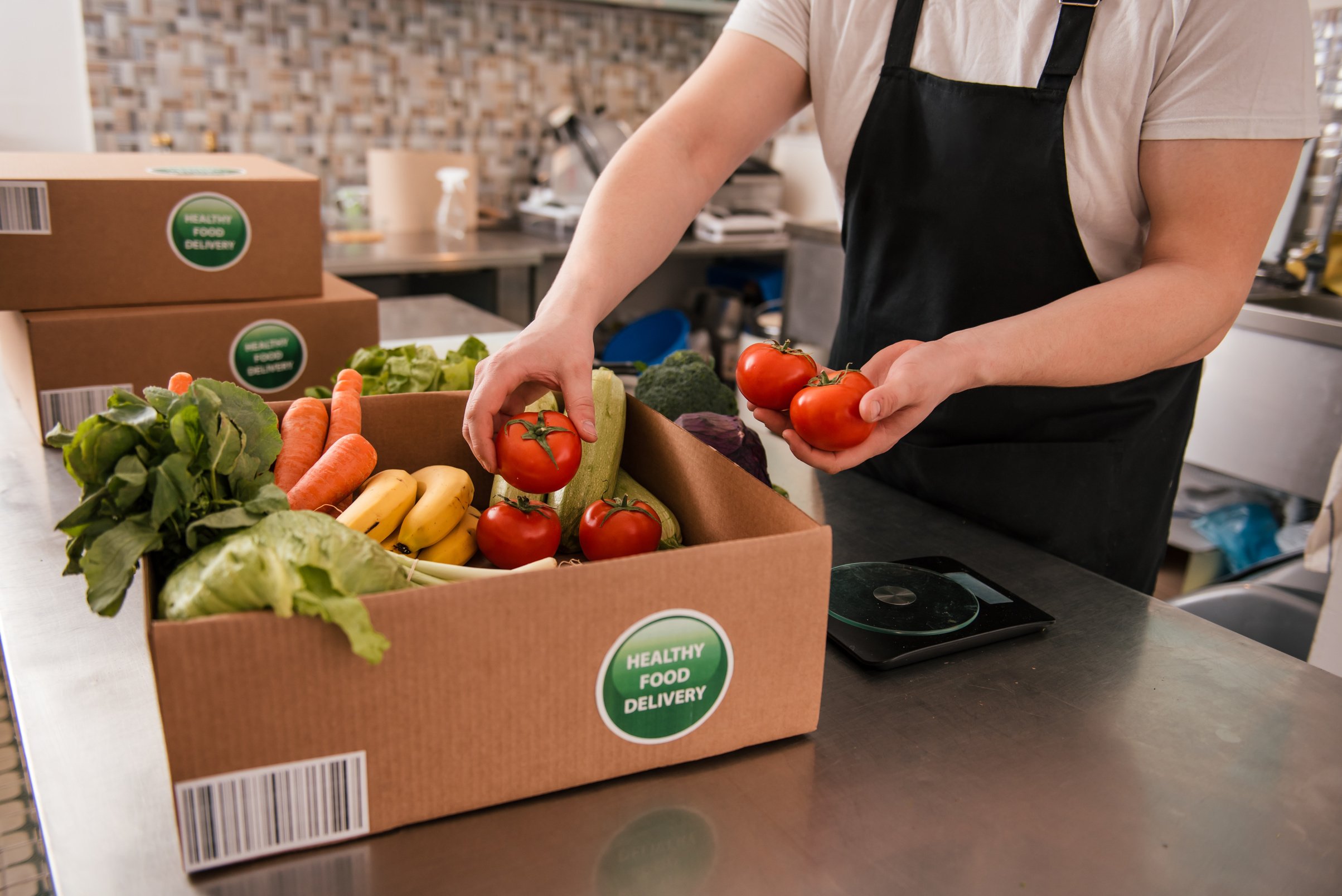 Man packing fresh fruits and vegetables